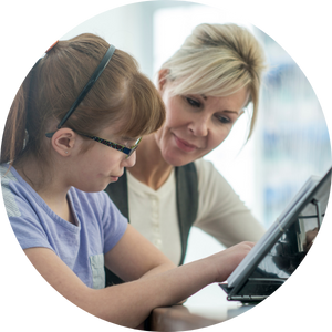 woman and girl in glasses working on iPad